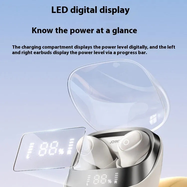 Beige wireless in-ear Bluetooth earbuds with a matching open charging case on a table.
