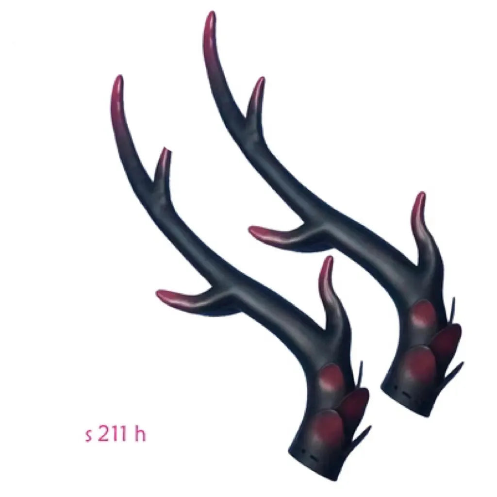 Pair of resin dragon horn decorations for motorcycle helmet in black and red finish, showing scale.