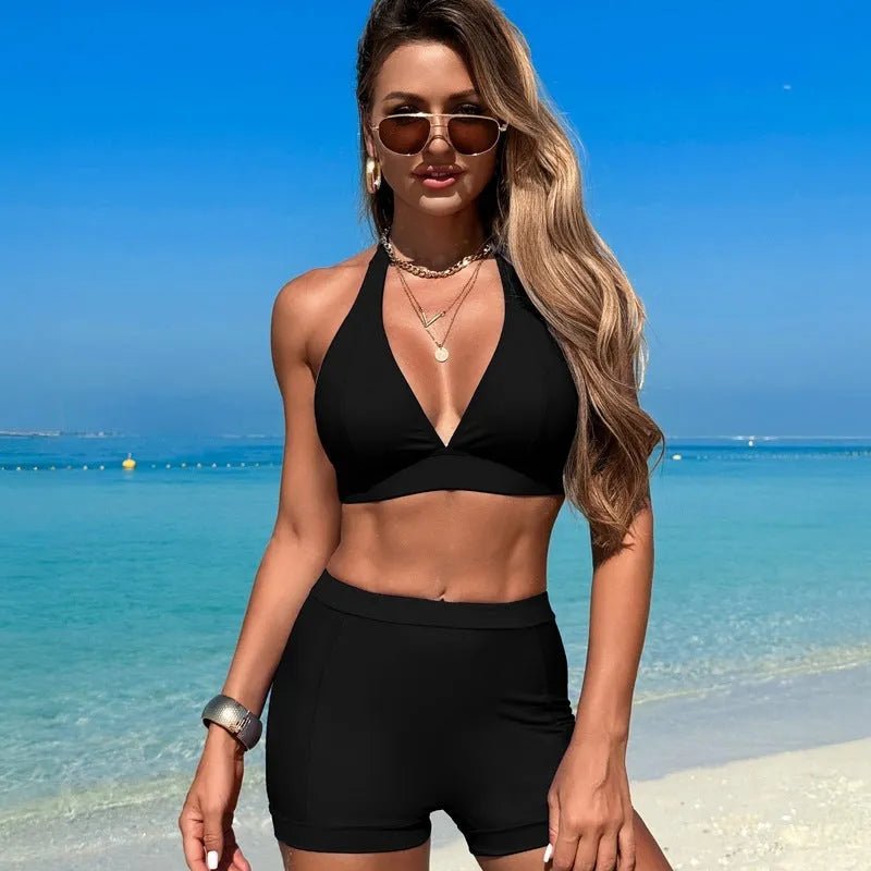 Women's black nylon bikini swimsuit set with sleeveless top and briefs on a neutral background