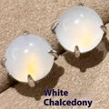 Chalcedony stud earrings with round egg surface design and four-claw settings in copper