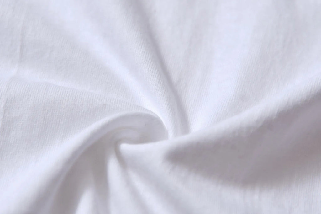 White cotton t-shirt overalls with round neck and short sleeves in loose fit