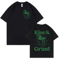 Rise And Grind Green Coffee cartoon graphic printed on a loose fit linen blend t-shirt.