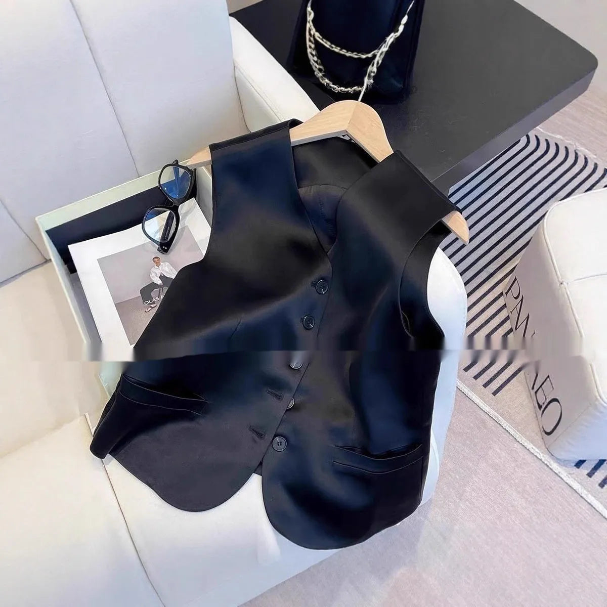 Black satin women's vest with sleeveless design and loose fit