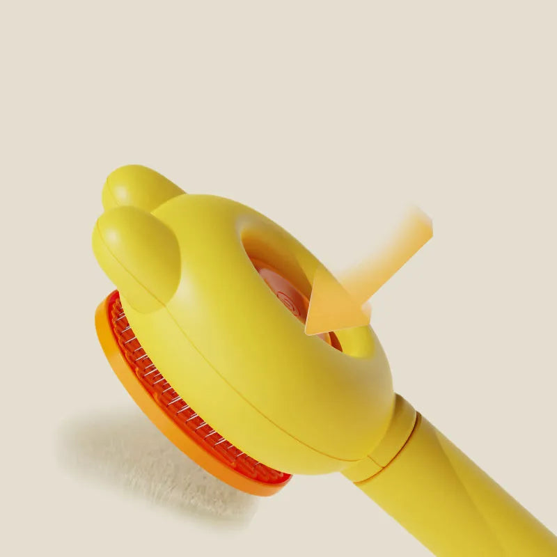 Self-cleaning pet hair brush with release button and rubber-tipped metal pins for cats and dogs.