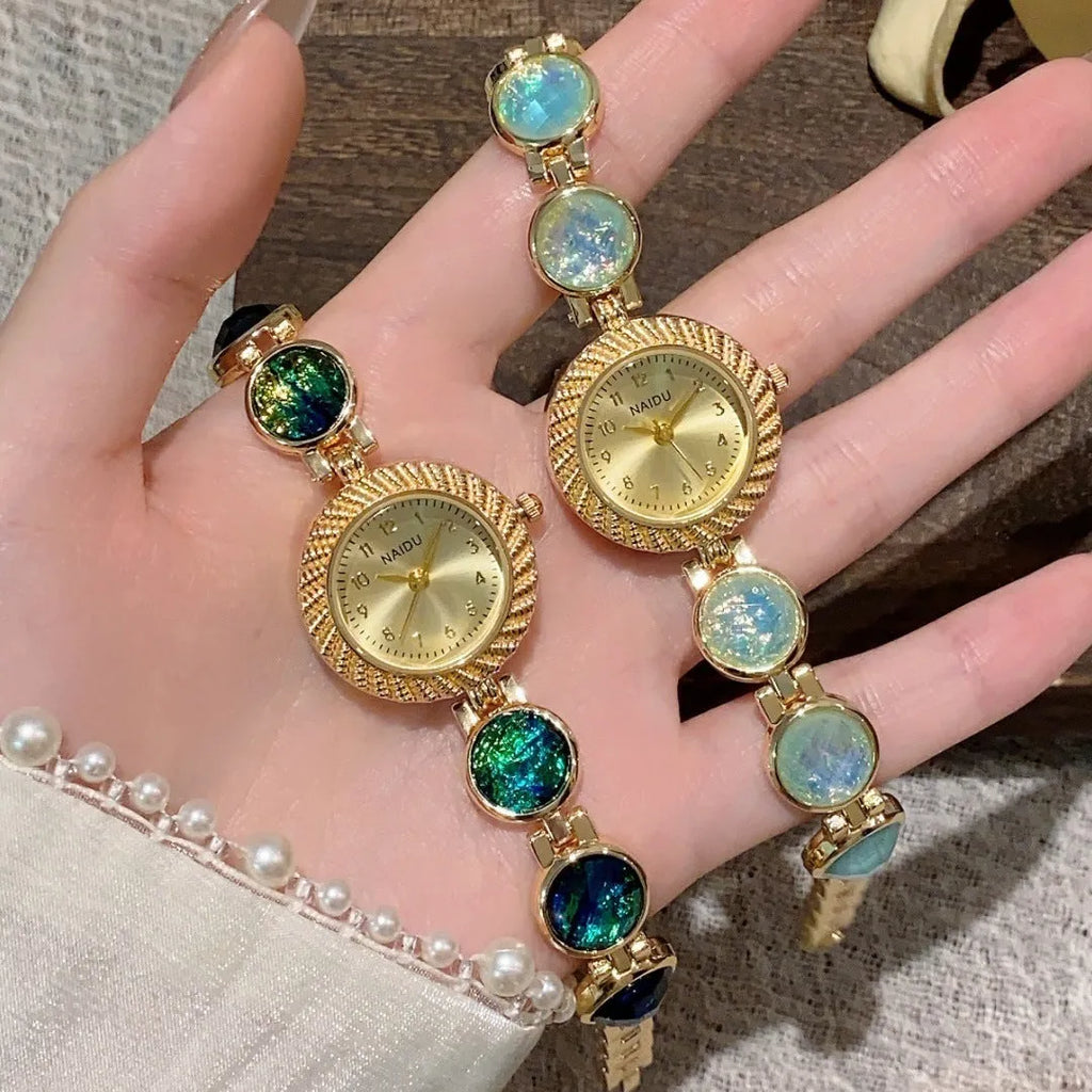 Women's quartz watch with 25mm round dial in zinc alloy case, shown in multiple colours.