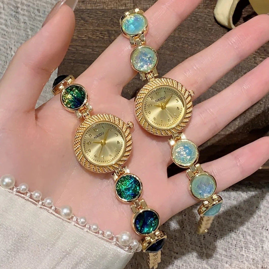 Women's quartz watch with 25mm round dial in zinc alloy case, shown in multiple colours.