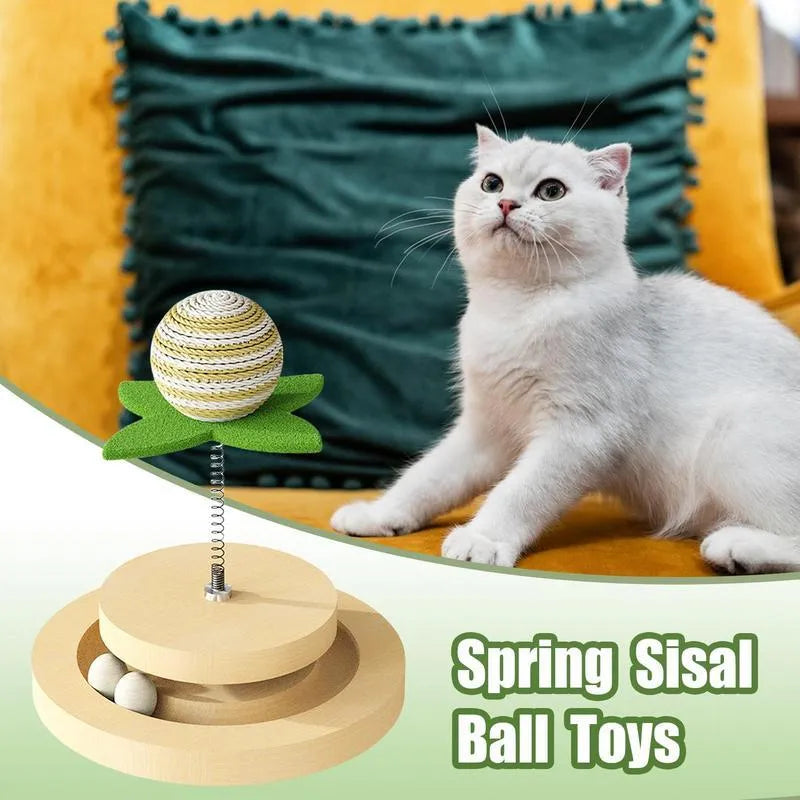 Green cat toy with a sisal scratching centre and a circular plastic ball track on a turntable.