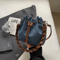 Blue synthetic leather cross body bucket bag with sandwich pocket and one-shoulder strap