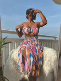 Yellow green printed women's bikini set with top, briefs, and matching beach skirt laid flat.