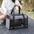 Oxford fabric pet carrier bag for dogs and cats, shown in grey with blue edge trim.