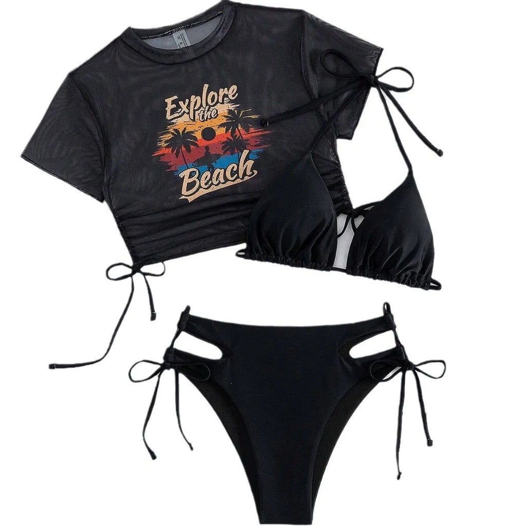 Women's three piece bikini swimsuit set in black, including bra, bottoms, and a short sleeved cover-up top.