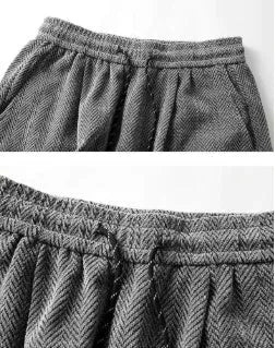 Light grey fleece-lined straight-leg casual trousers with elastic waistband on a hanger.