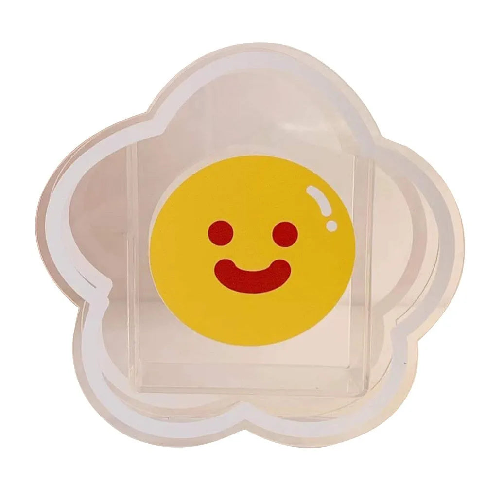 Square transparent acrylic storage box with a cute decorative design, shown on a desk.