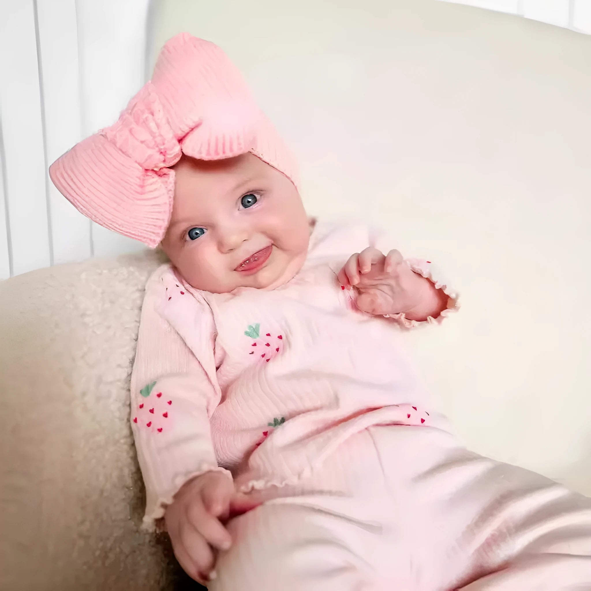 Infant wearing a light blue polyester 3-piece set with long sleeves, pants, and a matching hat.