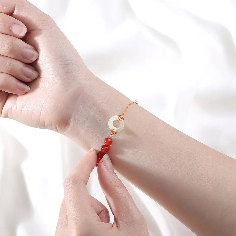 Women's sterling silver 925 bracelet with peace buckle, xiangyun, and fu character charms.