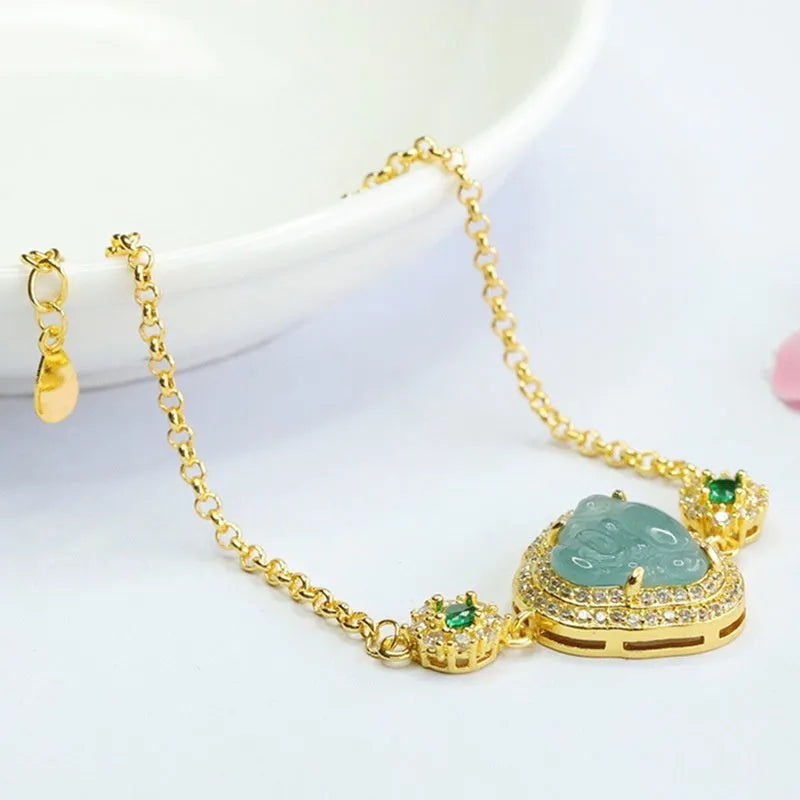 Jade bracelet with carved blue Maitreya Buddha charm and adjustable gold clasp