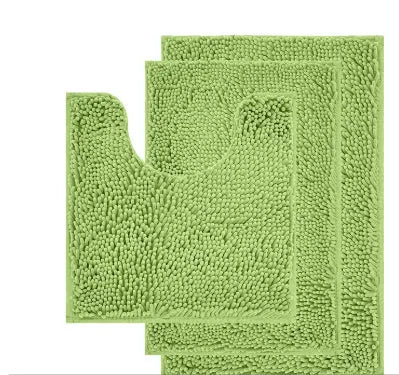 Chenille U-shaped three-piece bathroom carpet set in green beside a toilet.