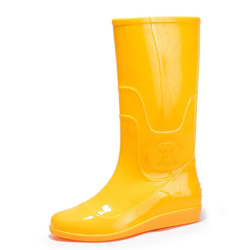 White plastic rain boots with high tube design and flat heel for outdoor labour protection