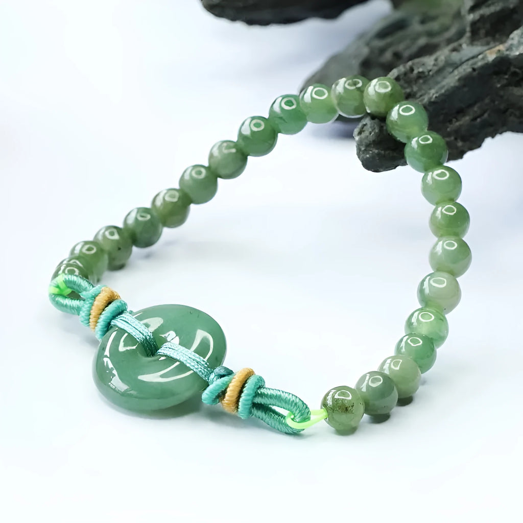 Emerald green jade bracelet with Chinese safety buckle and star-shaped 6mm beads.