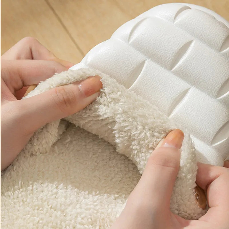 Women's pink detachable plush EVA winter house slippers with non-slip sole shown from the side.