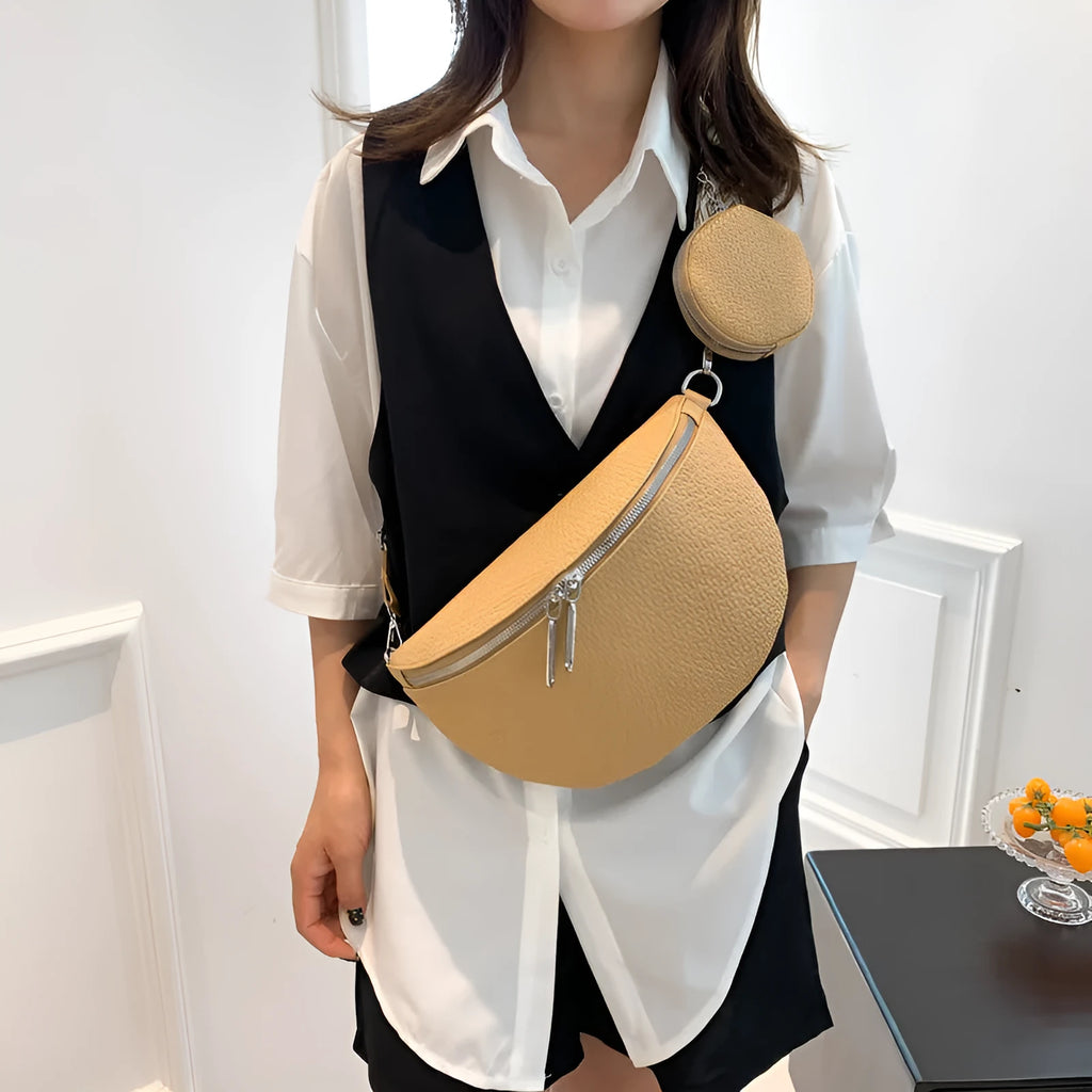Solid colour women's crossbody bag with textured saddle lock zipper detail in a horizontal square shape