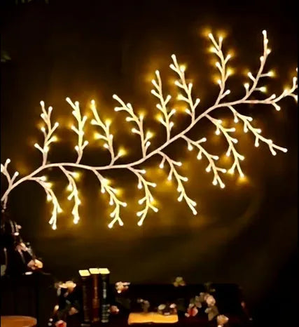 Flexible DIY willow vine Christmas garland with 144 warm white LED lights and birch bark texture.