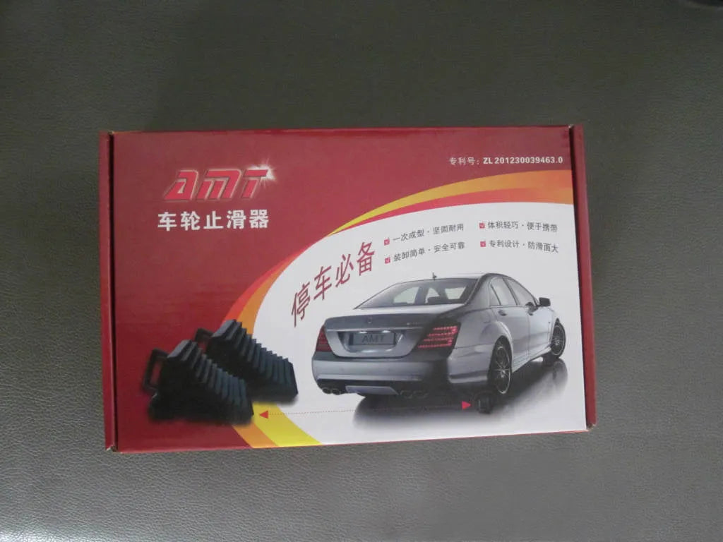 Pair of triangular car wheel stoppers in black colour with storage boxes