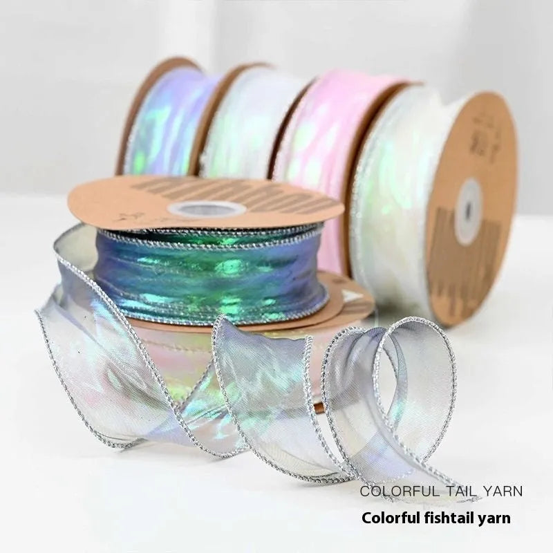 Roll of 4cm wide fishtail fringe mesh ribbon in Illusion Champagne colour.