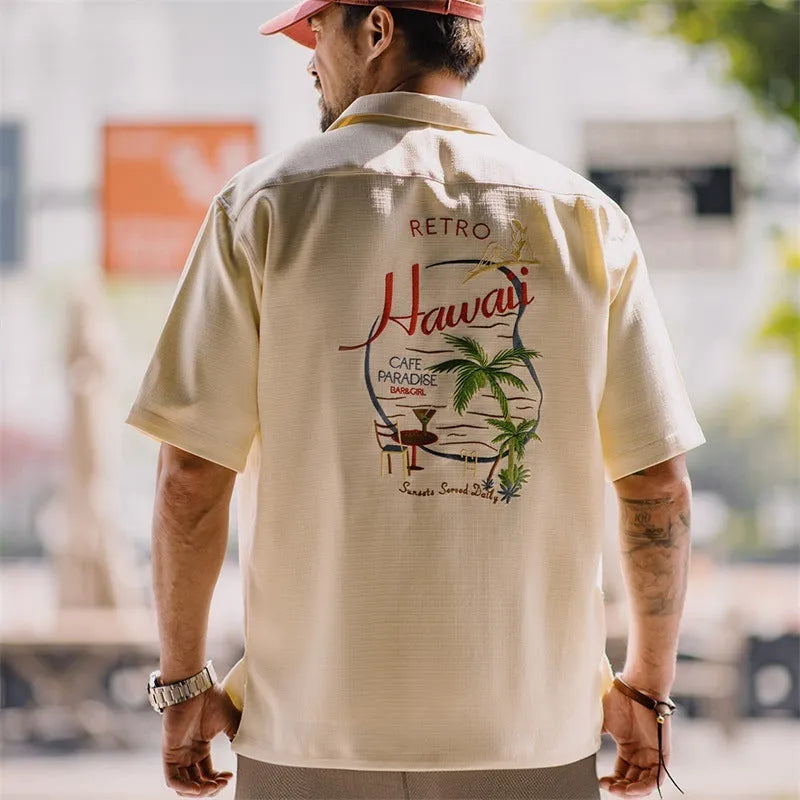 Men's light apricot shirt with bamboo floral print and a Cuban collar