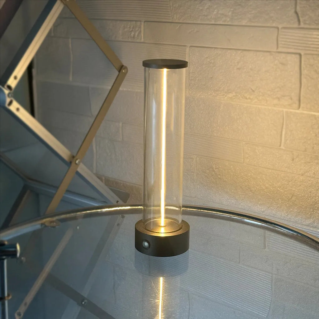 Slender glass LED light strip with magnetic base for USB charging night light.