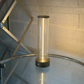 Slender glass LED light strip with magnetic base for USB charging night light.