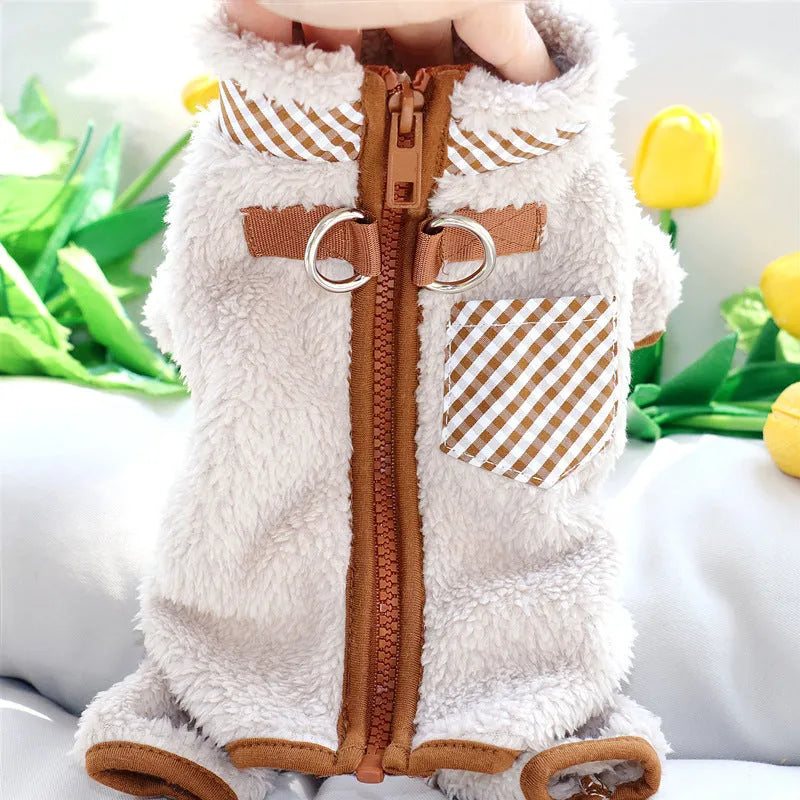 Green plush fleece dog jumpsuit with a back zipper on a small dog