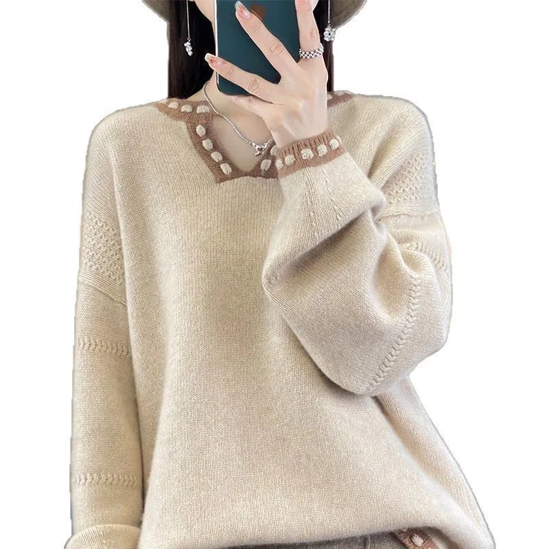 Women's camel coloured V-neck long sleeve viscose knit sweater on a hanger.