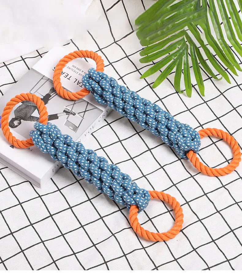 Blue braided cotton rope bone dog toy with double rings at each end for chewing and tooth cleaning