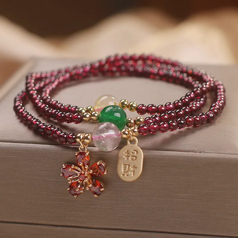 Women's natural crystal bracelet in pomegranate red cherry blossom colour with sequins detailing