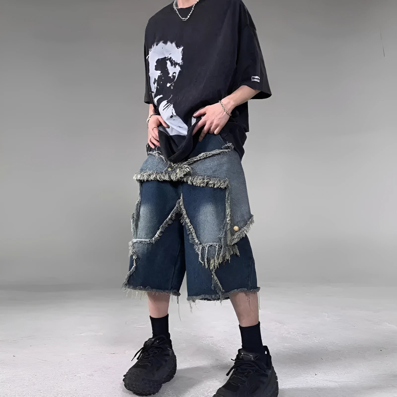 Blue denim shorts with frayed five-pointed star design and loose fit construction