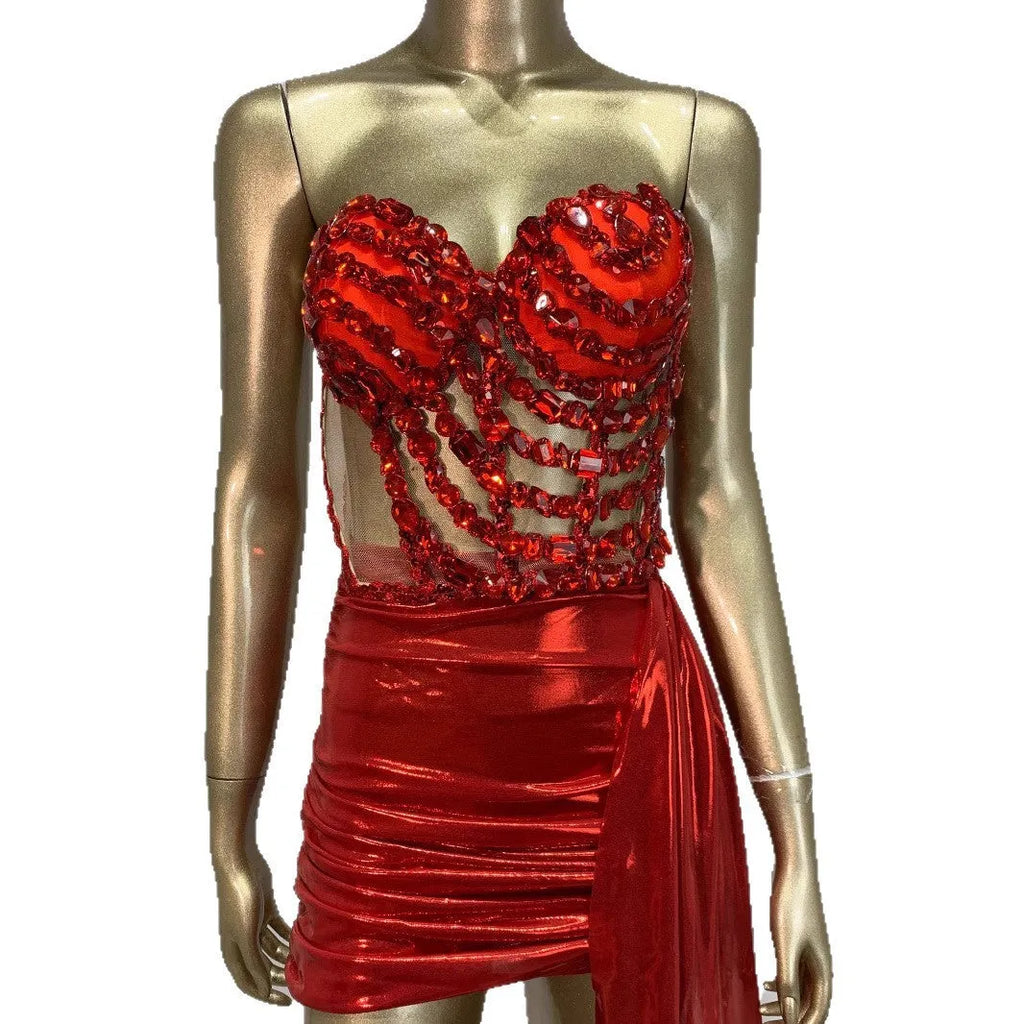 Red two-piece stage costume with hollow mesh panels and a skirt, made from stretch spandex for performers.