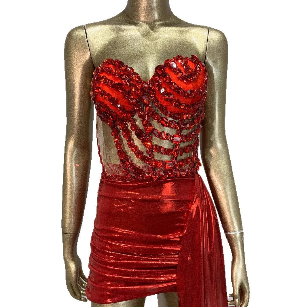 Red two-piece stage costume with hollow mesh panels and a skirt, made from stretch spandex for performers.
