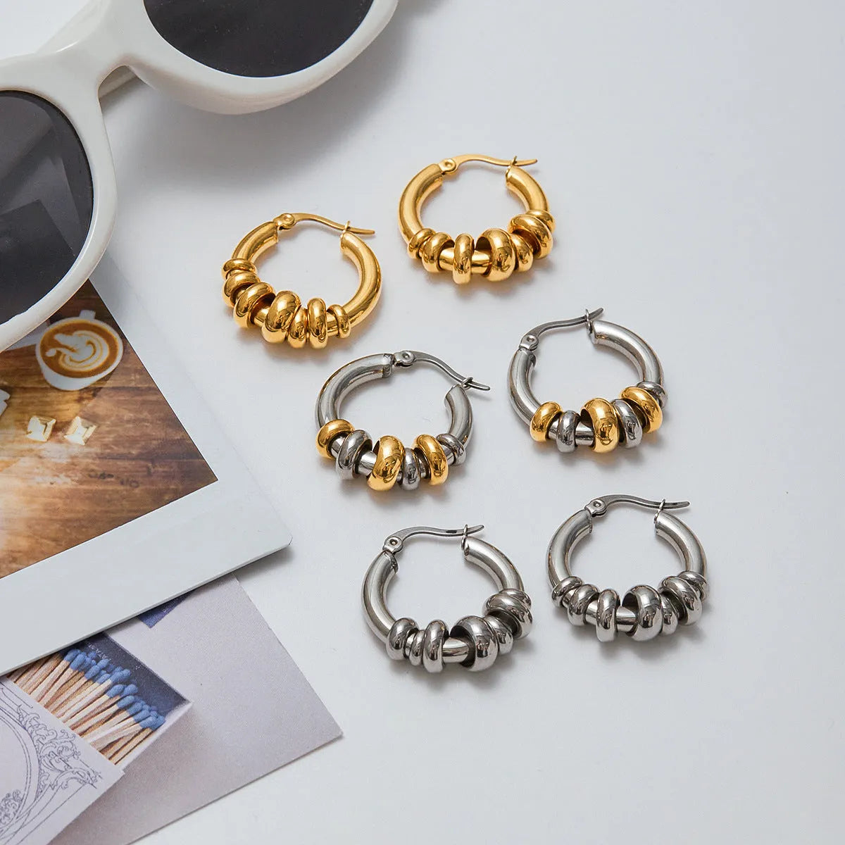 Women's stainless steel colour matching earrings in geometric ring style with electroplated gold finish
