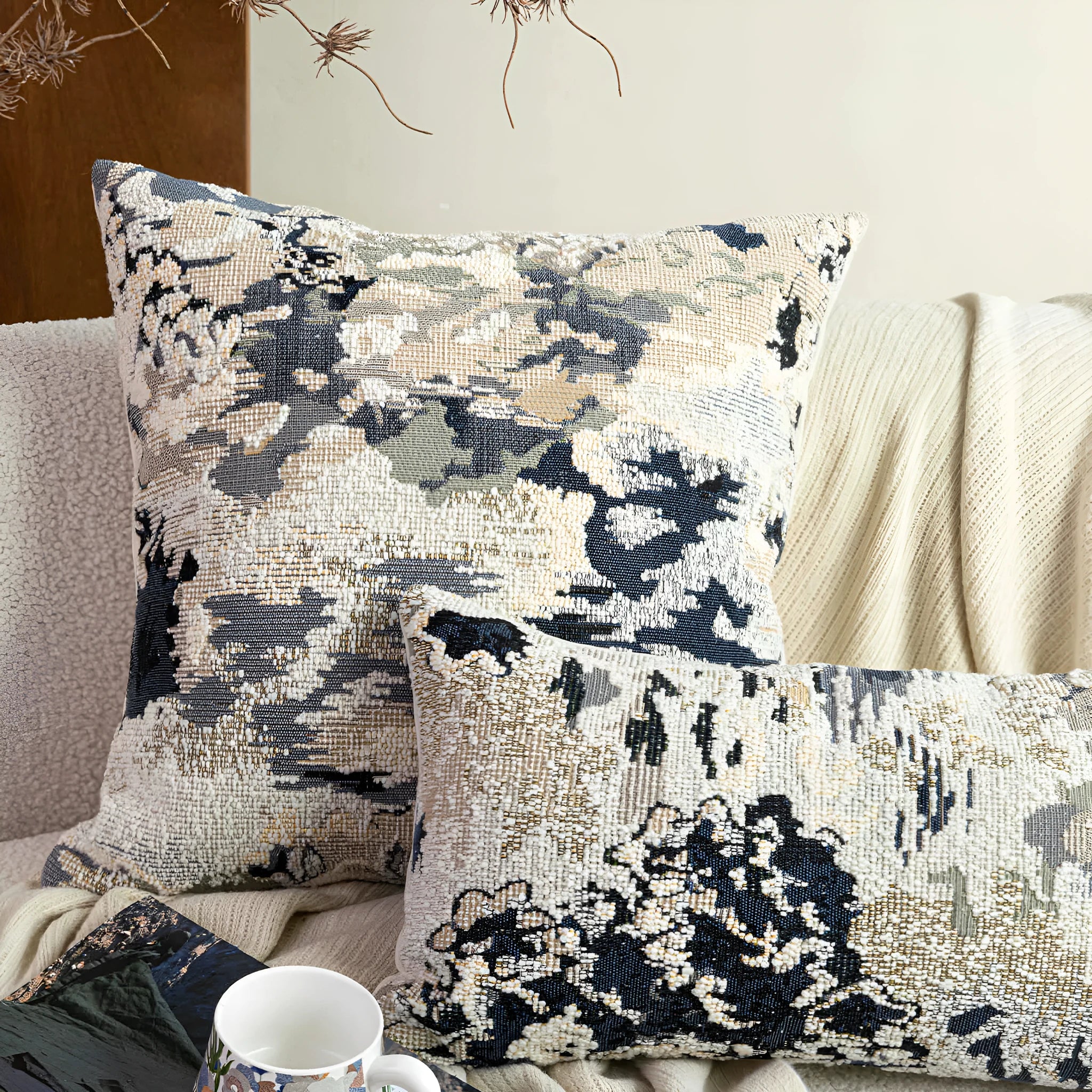 Antique blue wool blend decorative pillow with abstract flower pattern in square and waist pillow sizes.