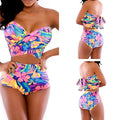 Red printed two-piece swimsuit for women with a chest wrap top and matching bottoms.