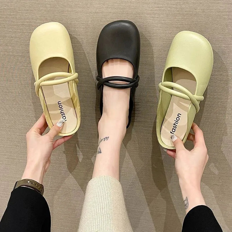 Ladies' plastic summer sandal with toe cap in green, shown from the side.