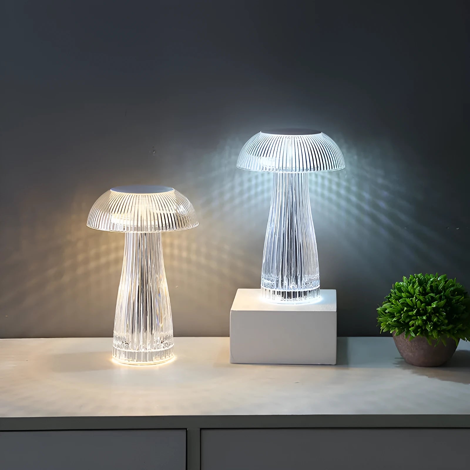 Creative crystal acrylic jellyfish table lamp with touch control and colour options on a desk