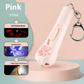 Pink USB-rechargeable cat toy base with a long white feather rotating on a wand, placed on a wooden floor.