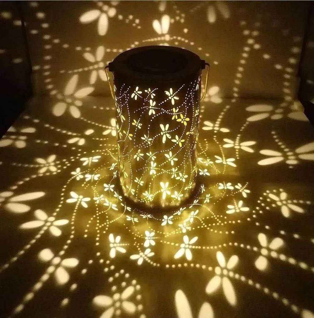 Solar-powered iron courtyard hanging lamp with decorative design for outdoor garden use.