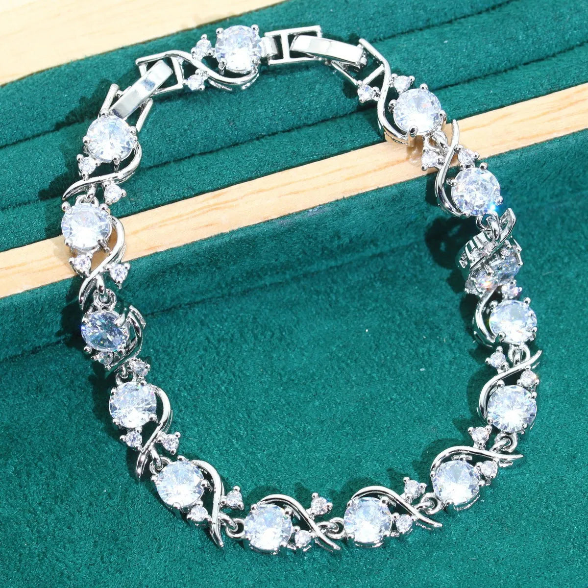 Four-piece bridal jewellery set showing necklace, bracelet, earrings and ring with alloy pendant and water wave chain