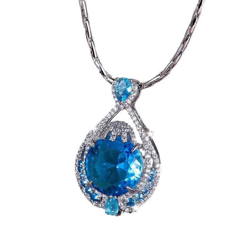 Women's geometric necklace with fireworks-cut blue gem pendant on water wave chain