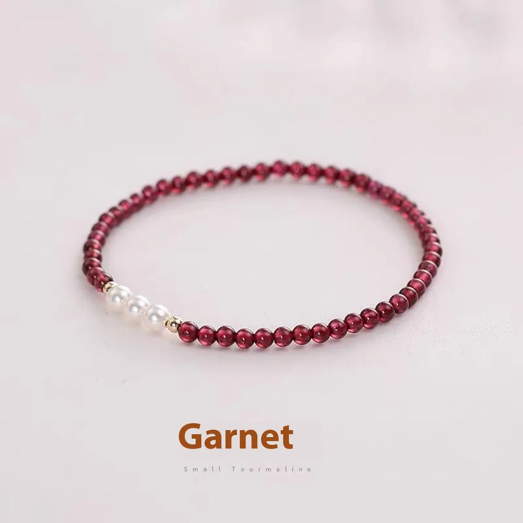 Women's garnet and artificial pearl bracelet with crystal details and adjustable clasp