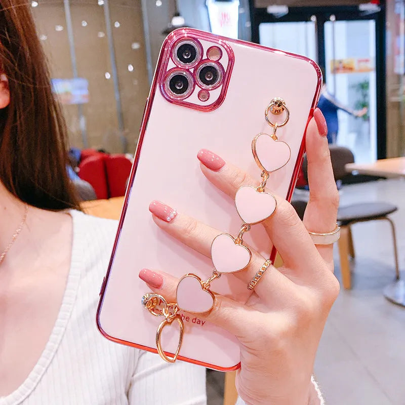 Green silicone phone case with a bracelet loop attached, compatible with Samsung and iPhone models.