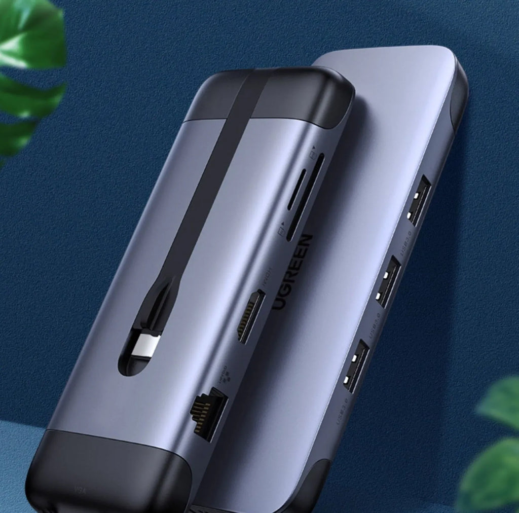 Compact 9-in-1 USB dock adapter with HDMI, VGA, Ethernet, USB 3.0, and card reader ports.